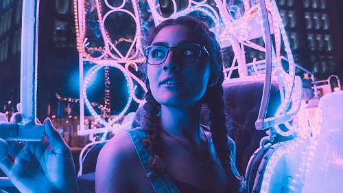 indianapolis woman wearing black framed eyeglasses riding amusement park ride united states